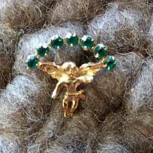 Angel pin with green emerald stones